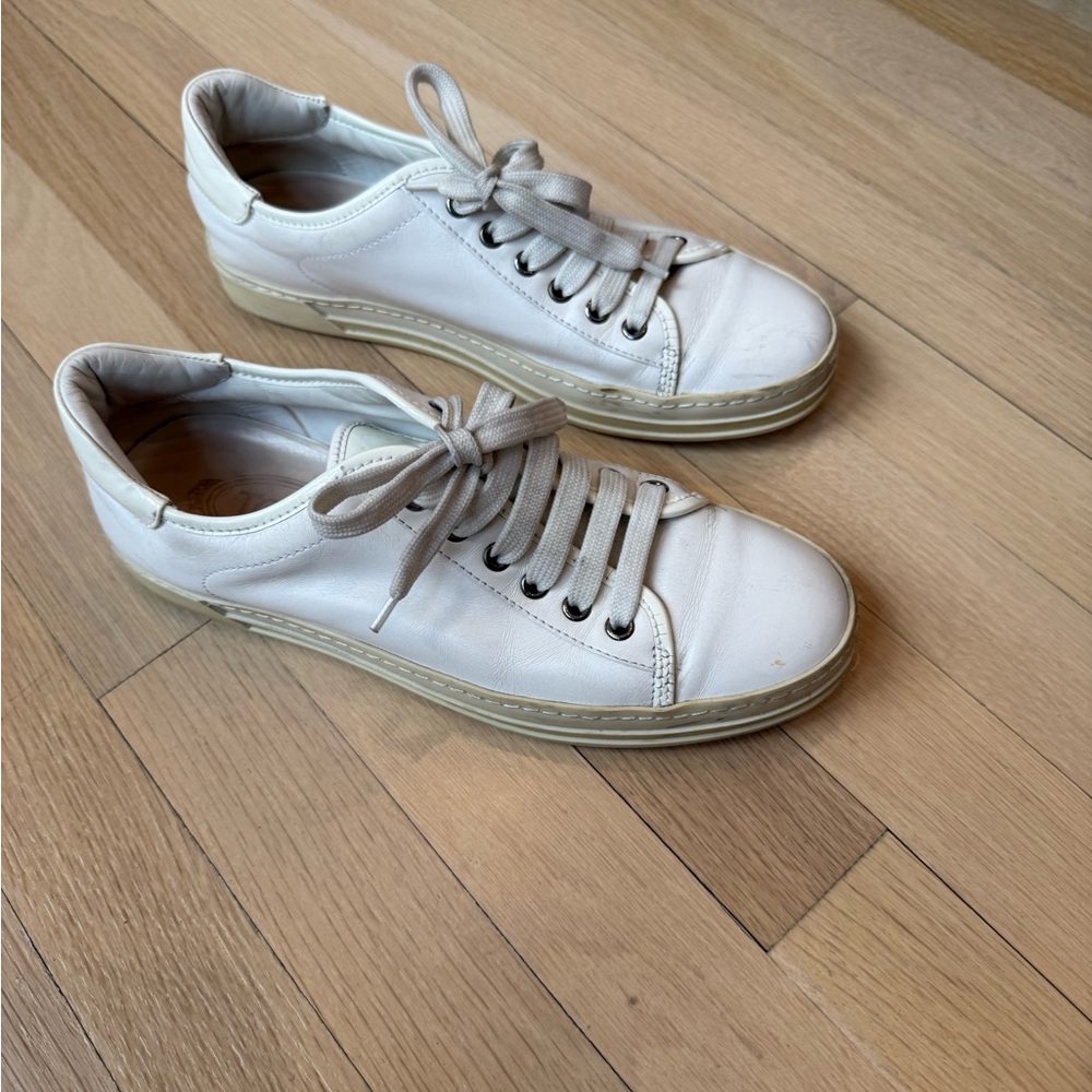 Tod’s white leather sneakers.